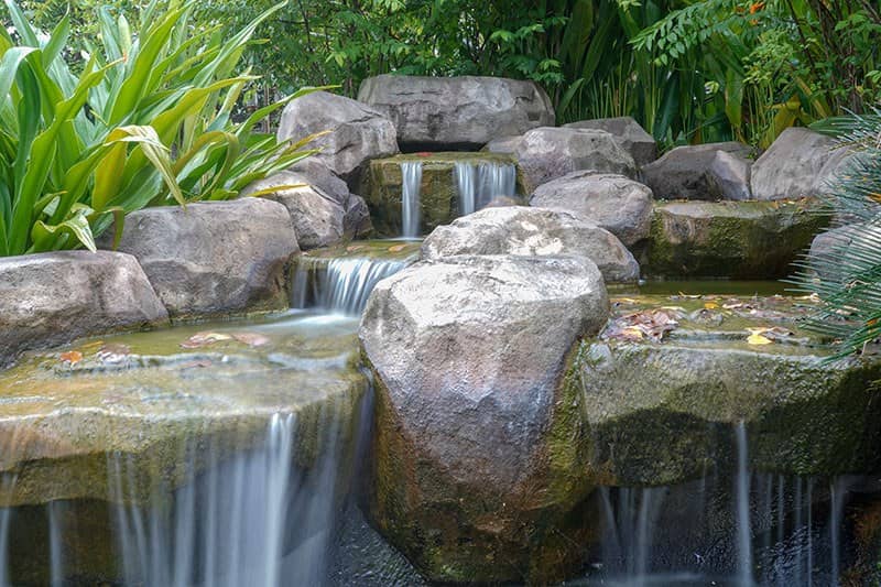 water cascading down a boulder water Feature