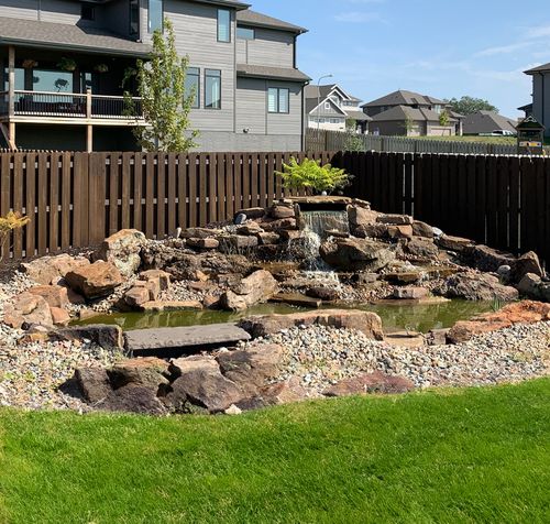 waterfall flowing into a pond