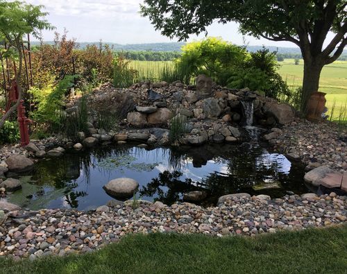 pond with boulder waterfall